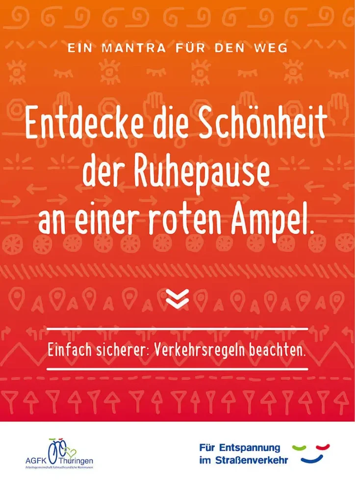 AGFK Thüringen Mantra für den Weg "Entdecke die Schönheit der Ruhepause an einer roten Ampel." rotes Plakat